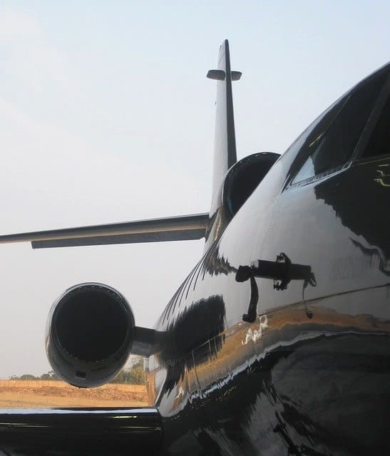 partial photograph of black plane representing aerospace metal finishing